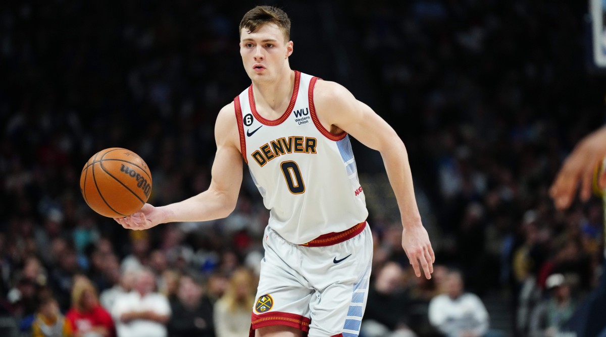 Nuggets guard Christian Braun handles the basketball during a game.